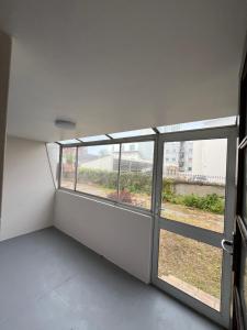an empty room with a window in a building at Robridon in Summerstrand