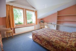 Voodi või voodid majutusasutuse Etoile des Neiges Hôtel et Piscine toas
