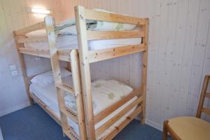 Voodi või voodid majutusasutuse Etoile des Neiges Hôtel et Piscine toas