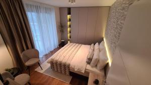 Postel nebo postele na pokoji v ubytování Melody Apartment
