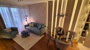 Posezení v ubytování Melody Apartment