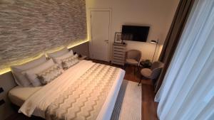 Postel nebo postele na pokoji v ubytování Melody Apartment