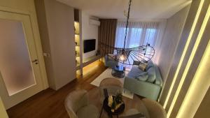 TV a/nebo společenská místnost v ubytování Melody Apartment