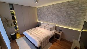 Postel nebo postele na pokoji v ubytování Melody Apartment