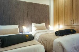 Una cama o camas en una habitación de Apto nuevo a 5 min de CC Centro Mayor