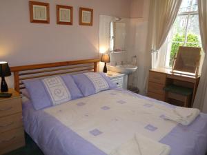 Postel nebo postele na pokoji v ubytování St Annes Guest House