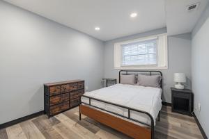 a bedroom with a bed and a window at Modern Updated Two Bedroom Condo in Washington, D.C.