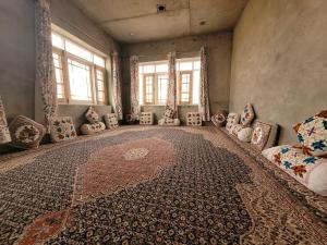 a room with pillows and a rug on the floor at POP Home Sharik Homestay 