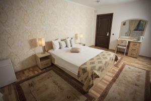 Кровать или кровати в номере City Garden Rooms and Apartments