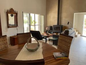 a living room with a table and a couch at Chalet Las Brisas in Cullera