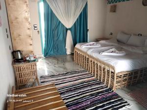 Posteľ alebo postele v izbe v ubytovaní Miskaa Nubian House