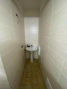 a small bathroom with a sink and a toilet at A Casa re nonn in Naples