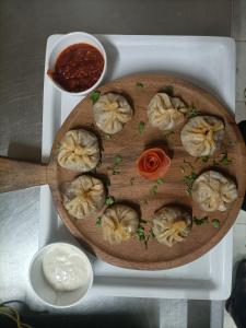 a plate of dumplings on a cutting board at Jai hari vilas in Jodhpur