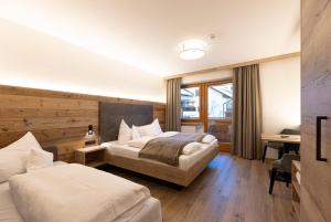 Postel nebo postele na pokoji v ubytování Hotel Thuinerwaldele