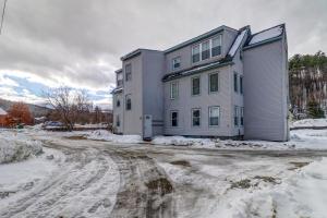 a house on a dirt road in the snow at Depot Street Condo in Proctorsville