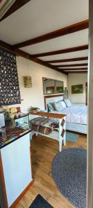 a bedroom with two beds and a counter in a room at House of Art in Haenertsburg