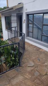a balcony of a house with a view of the ocean at 56 ArcherCrescent Cottage in Durban
