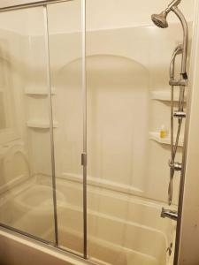 a shower with a glass door in a bathroom at Experience Your Journey with Us 1 in Mexico