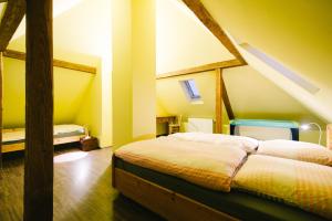 a bedroom with a large bed in a attic at Charmantes Turmzimmer 
