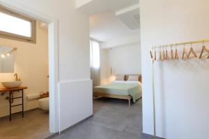 Ένα ή περισσότερα κρεβάτια σε δωμάτιο στο Petra - Sud Est Charme