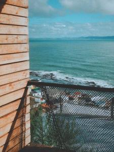 a view of the ocean from the balcony of a house at Alojamiento Vista al Mar Concepción, Tomé, Cocholgüe in Concepción +28 photos