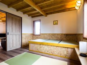 A bed or beds in a room at Country Cottage Waki Aiai - Vacation STAY 26548v