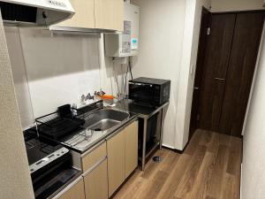 A kitchen or kitchenette at Tsunageru Aomori Yasukata - Vacation STAY 25824v