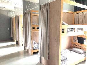 a group of bunk beds in a room at LivingAnywhere Commons Uruma Male Dormitory bunk bed - Vacation STAY 15526v in Uruma
