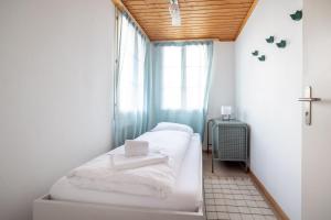 Voodi või voodid majutusasutuse Chalet Seehus Iseltwald toas