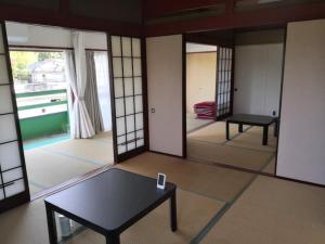 a living room with a table and a mirror at Bouldering & SPA -Ariki Resort Shuzenji ANNEX- - Vacation STAY 07698v in Izu