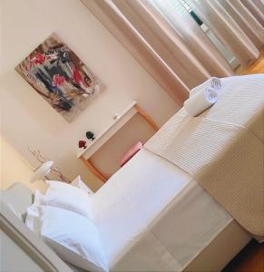 Postel nebo postele na pokoji v ubytování Calogiuri Nest + 32 fotografií