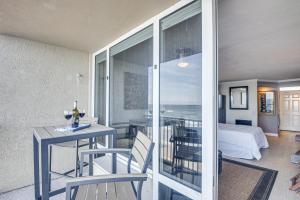 a room with a table and chairs and a bedroom at Daytona Beach Retreat Beach Access! in Daytona Beach