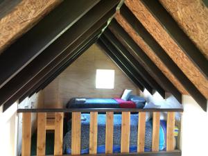 A bed or beds in a room at Tiny House, Tiny Black Frutillar