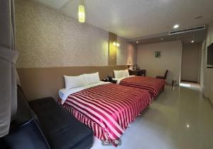 Letto o letti in una camera di Hua Xiang Motel - Arena