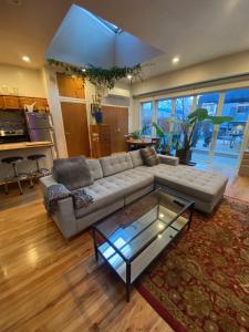 a living room with a couch and a coffee table at Carriage House Williamsburg Brooklyn NYC HUGE STUDIO in Brooklyn