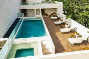 un'immagine di una casa con piscina di Bunah Tulum -Distinctive Hotels- a Tulum