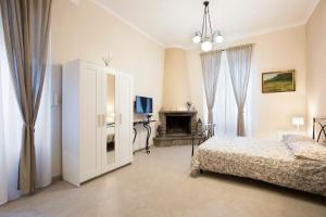 Ένα ή περισσότερα κρεβάτια σε δωμάτιο στο B&B La Sosta - Vista Esclusiva Chiesa di Santa Rosa +29 φωτογραφίες