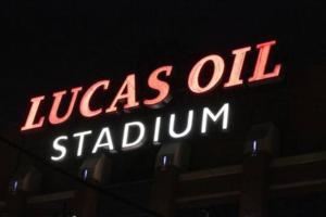 a neon sign that reads lucas oil stadium at Downtown Morado Loft #2, FREE Parking & Skywalk to Lucas Oil & Conv Center in Indianapolis