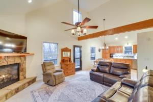 a living room with a couch and a fireplace at The Eagles Nest at Alpine Cabin with Fireplace! in Terra Alta