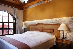Rúm í herbergi á Meson de Juan Valle