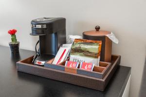 a tray with a coffee maker on a table at KC Inn Hotel Kansas City in Kansas City