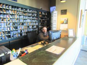 a man sitting at a counter in a coffee shop at Sugar Top 2423 condo in Sugar Mountain