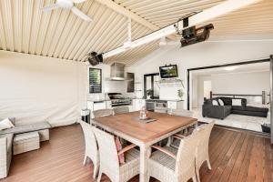 a dining room and living room with a table and chairs at Perfect CDB & Parkland Fringe! in Toowoomba