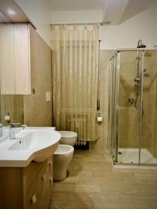 a bathroom with a sink and a toilet and a shower at Venice VIP Guest House in Mestre +37 photos