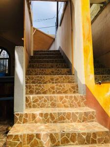 a set of stone stairs in a building at Mi casa es tu casa in San Pedro La Laguna