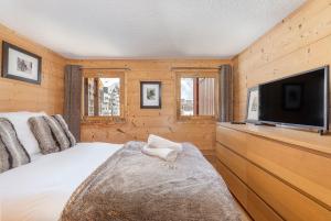 Ένα ή περισσότερα κρεβάτια σε δωμάτιο στο Val Thorens-Cosy Duplex avec Vue Silveralp 681 +23 φωτογραφίες
