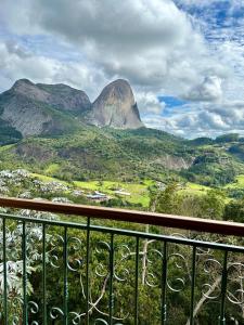 a view of a mountain from a balcony at Vista Azul Hotel in Domingos Martins