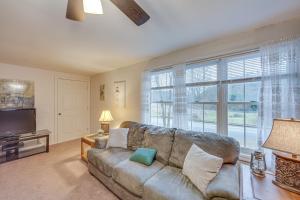 a living room with a couch and a large window at Tranquil Mt Pleasant Mills Retreat on 60-Acre Farm in Dalmatia