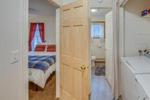 a bedroom with a bed and a bathroom with a sink at Tranquil Mt Pleasant Mills Retreat on 60-Acre Farm in Dalmatia