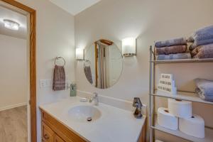 a bathroom with a sink and a mirror and towels at Tranquil Mt Pleasant Mills Retreat on 60-Acre Farm in Dalmatia +22 photos